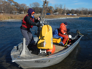 Val Stanley, Minnesota Geological Survey, secured the towfish and Jeff Ziegeweid, USGS Minnesota Water Science Center, prepared to conduct water-borne geophysical surveys on White Bear Lake.