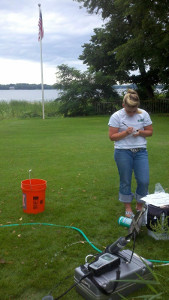Hydrologic Technician measuring a well