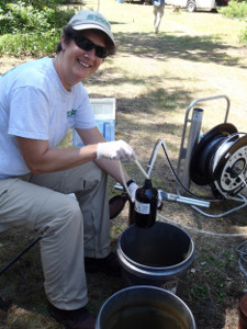 Dr. Mindy Erickson collects a groundwater sample at the hydrocarbon spill site near Bemidji, Minnesota