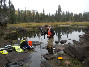 Daniel Morel and Molly Trombley, USGS Minnesota Water Science Center, collecting water samples and measuring streamflow on Filson Creek, September 30, 2014.