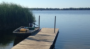 A sampling boat docked on Pearl Lake