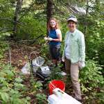 Mindy and Erin sample groundwater by Unnamed Lake