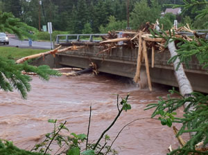Flood-splintered trees jammed against the Church Street Bridge near the USGS streamgage on the Knife River near Two Harbors and Duluth, MN, June 20, 2012 Credit: Josh Larson
