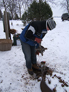 Tom Van Heel, your humble webmaster, measuring a residential well in Olmsted County, MN.