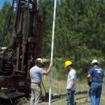 Jared Trost, John Greene, and Brent Mason installing a new vapor well during the 2012 Field Session