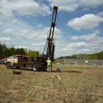 John Greene and Brent Mason installing a well in the pipeline area in May 2012